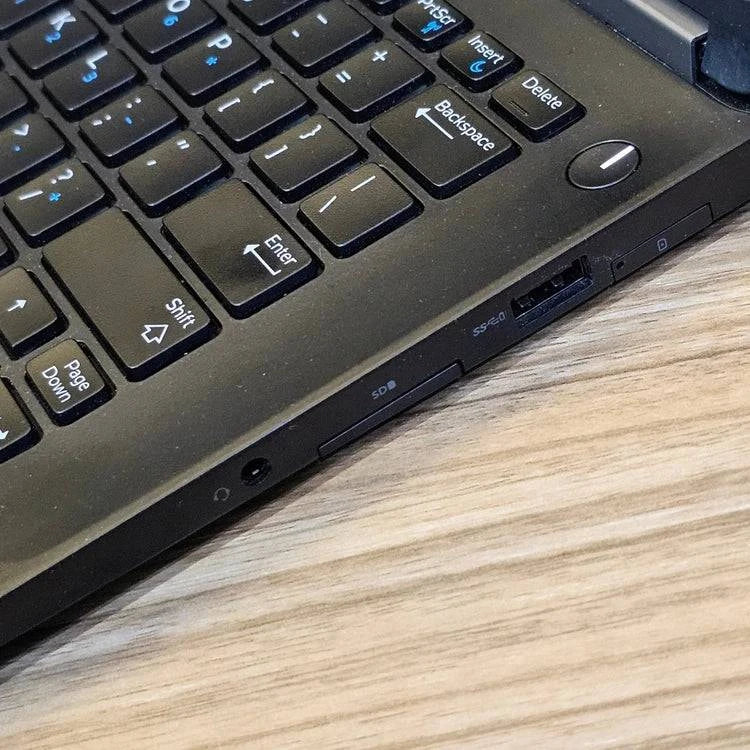 Dell Latitude E7270 business laptop with 8GB RAM and 256GB SSD, shown with external wireless adapter on a workspace.