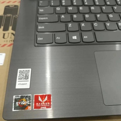 Lenovo IdeaPad V330 laptop with 14-inch Full HD display, Ryzen 5 processor, 4GB RAM, and 500GB HDD, shown open on a desk.
