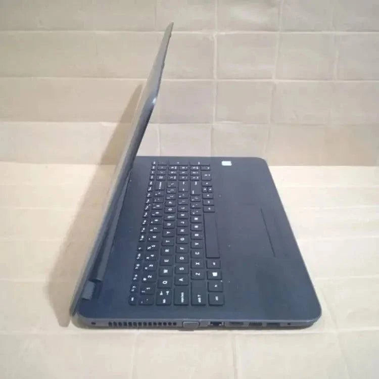 SariQart HP 250 G5 Notebook PC open with keyboard and screen visible, showing a sleek silver design for everyday computing.