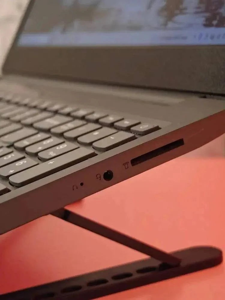 Lenovo Idea V15 laptop with AMD Ryzen 5 2500U processor, black design, open showing keyboard and screen.