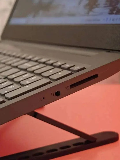 Lenovo Idea V15 laptop with AMD Ryzen 5 2500U processor, black design, open showing keyboard and screen.