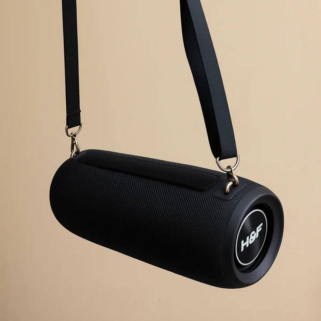 Wireless portable Bluetooth bass speaker from SariQart showing a compact, sleek design with control buttons and a built-in handle.