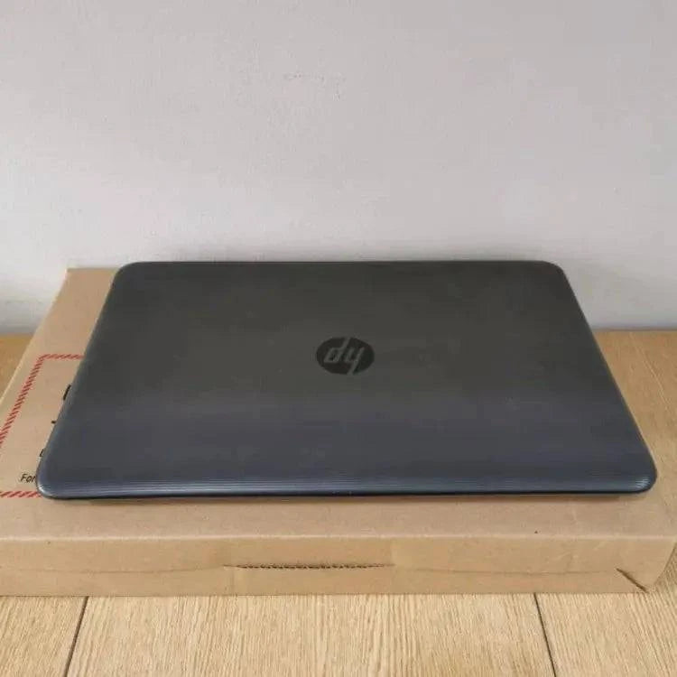 HP 250 G5 Notebook PC with black keyboard and screen displaying desktop, featuring a sleek design and standard ports.