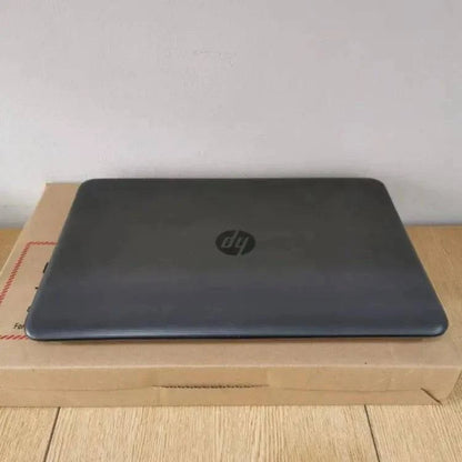 HP 250 G5 Notebook PC with black keyboard and screen displaying desktop, featuring a sleek design and standard ports.