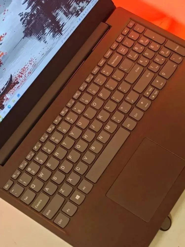 Lenovo Idea V15 laptop with AMD Ryzen 5 2500U processor, featuring a sleek design and full keyboard, displayed on a plain background.