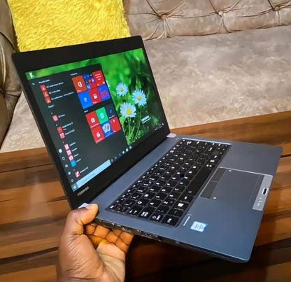 Toshiba Portege Z30-A laptop with Core i7 processor, 8GB RAM, 256GB SSD, and touchscreen display on a sleek design.