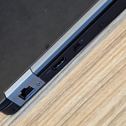 Dell Latitude E7270 business laptop with 8GB RAM, 256GB SSD, and external wireless adapter, shown open on a desk.